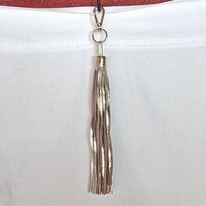 9" gold leather tassle EUC